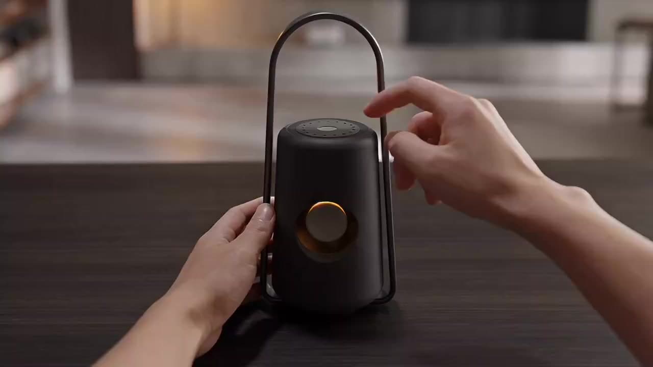 First frame of the Halo Lantern film: two hands reach for the dial on top of the lantern as its lamp begins to glow